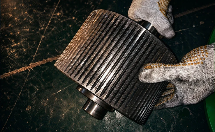 Textured surface alloy steel pressure roller assembly for ring die pellet mill to increase material gripping force