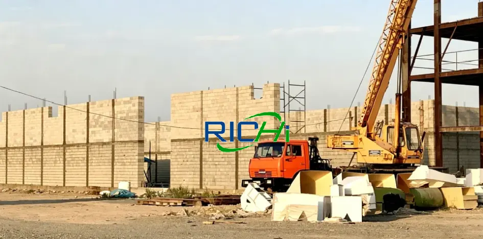 Workers install complete cow dung pellet production line, turnkey organic manure fertilizer processing equipment